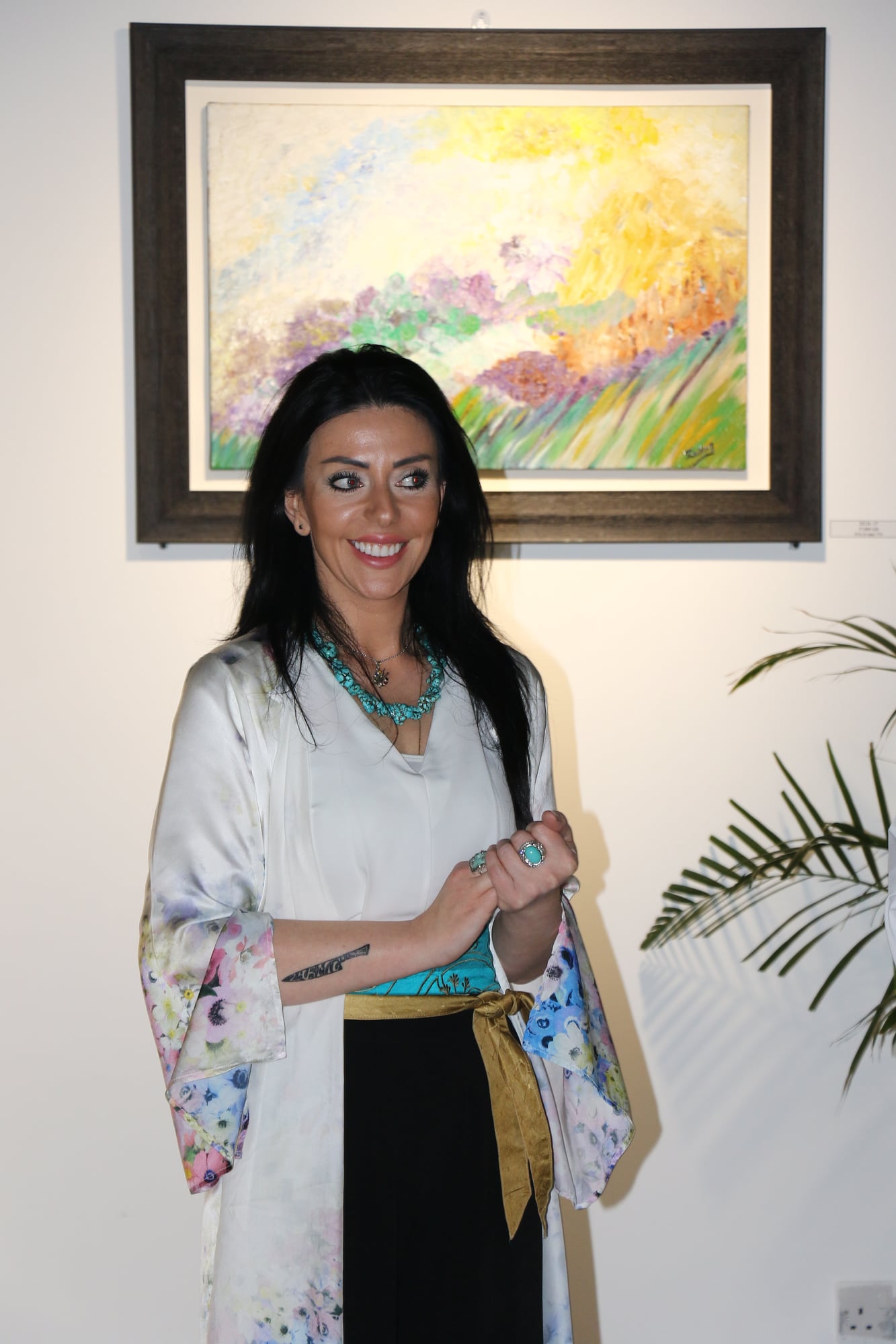 Chef Zarmig with one of her paintings