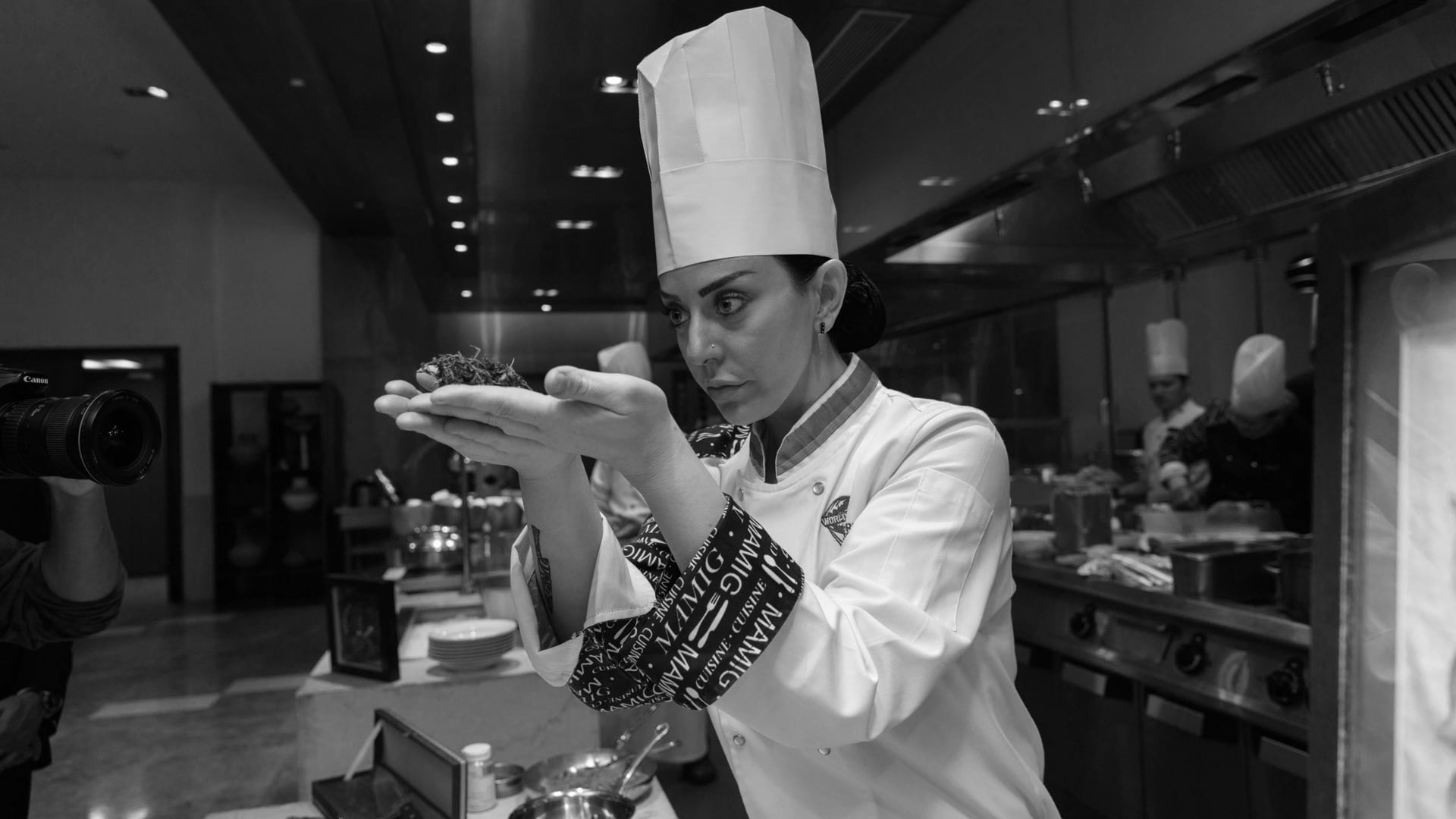 Chef Zarmig creating a dish in the kitchen